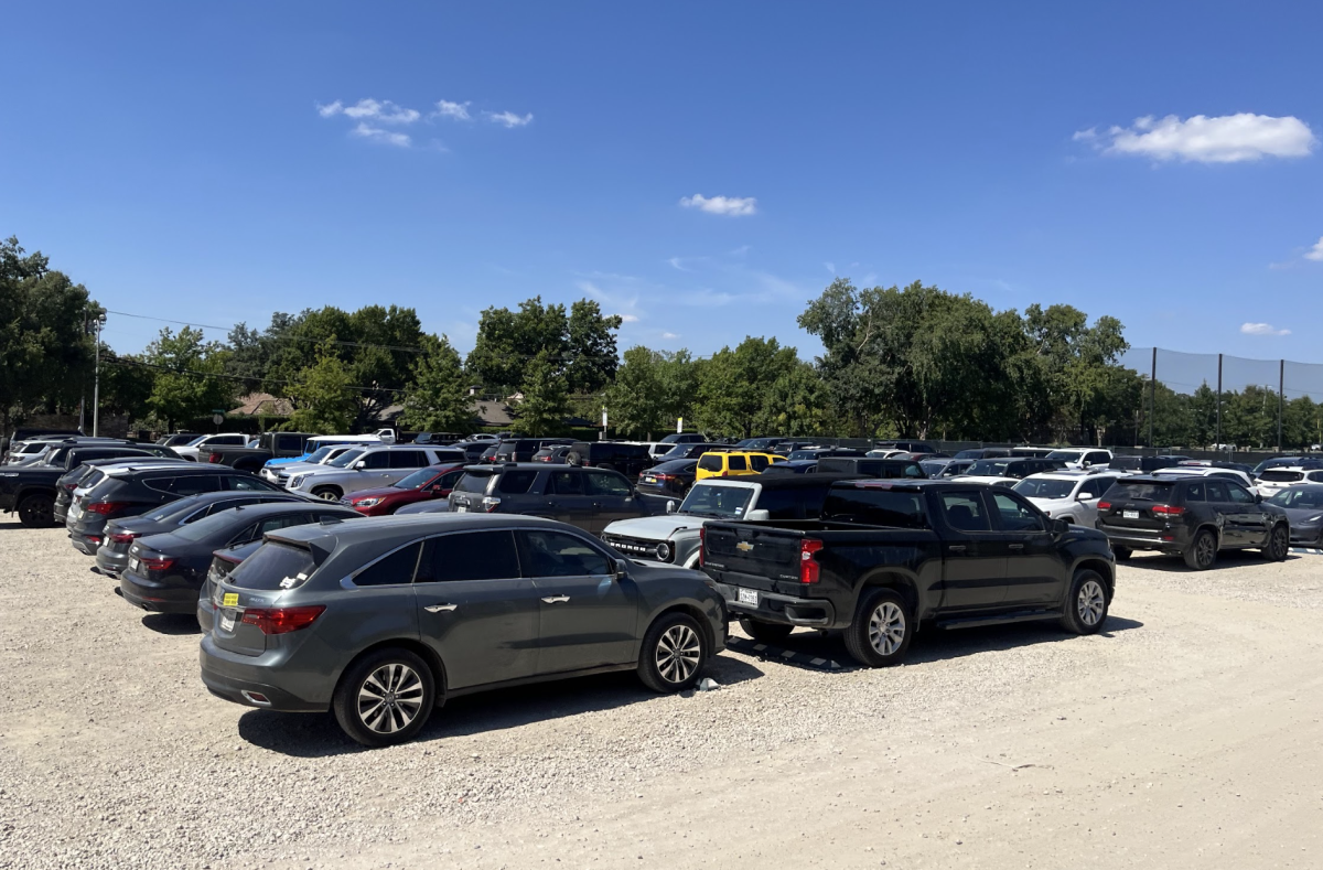 Students cars fill the temporary lot.